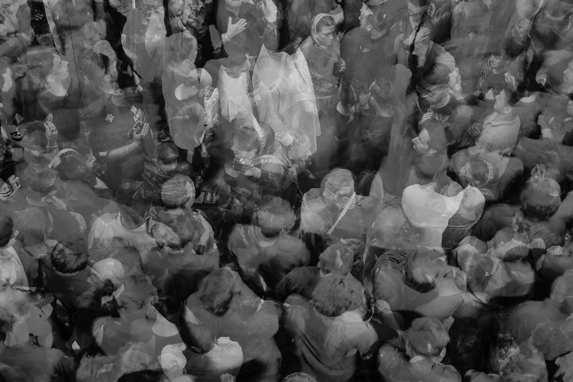 Overlapping exposures of a crowd seen from above, from Horse / Men by Nad-E-Ali